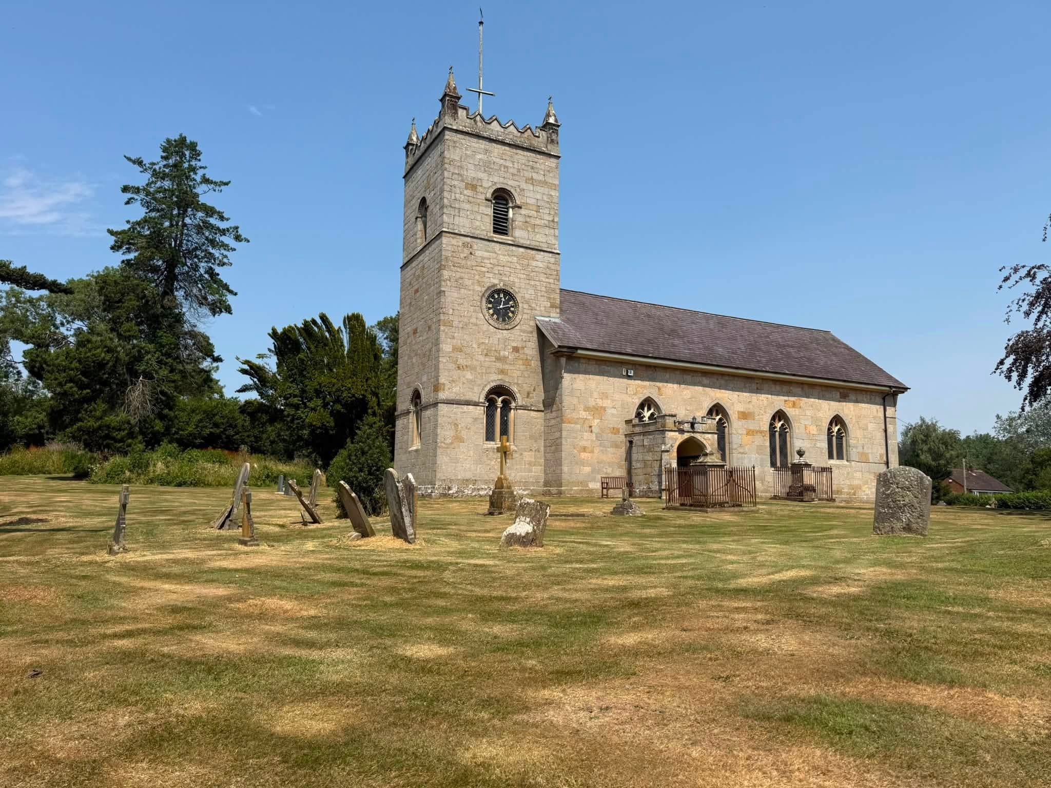 The churchyard tidied up, grass strimmed neatly around the headstones and church